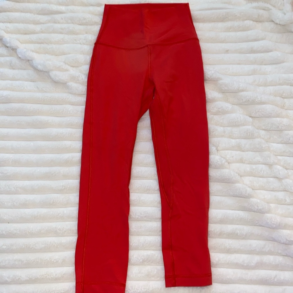 Lululemon high rise crop 21” size 2. Color: redish orange, more red than orange.